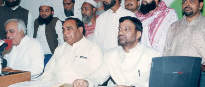 Mohammed Younus Siddiqui President of All India Muslim Unity Front addressing a press conference at the congress headquarter 24 Akbar Road to support congress party in the general parliament election held in 2004.  Mr. Kapil Sibal spokesman of Congress an